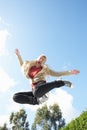 Young Woman Jumping On Trampoline Caught In Mid Ai Royalty Free Stock Photo