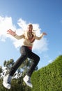 Young Woman Jumping On Trampoline Caught In Mid Ai Royalty Free Stock Photo