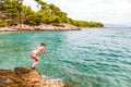 Young woman jumping in the water Royalty Free Stock Photo