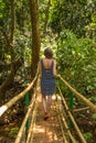 Young woman in the jungle on the bridge in tropical spice plantation, Goa, India