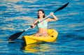 Young woman in a kanu kayak exercising in the ocean Royalty Free Stock Photo