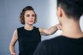 Young woman karate student with her trainer in gym. Taekwondo coach teaching adult woman in personal training. Two women