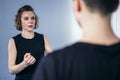 Young woman karate student with her trainer in gym. Taekwondo coach teaching adult woman in personal training. Two women Royalty Free Stock Photo