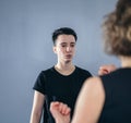 Young woman karate student with her trainer in gym. Taekwondo coach teaching adult woman in personal training. Two women Royalty Free Stock Photo