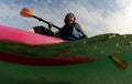Young woman in kayak on ocean