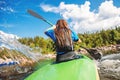 Young woman on kayak with spray paddle. Concept travel summer day