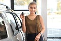 Young woman with key near new car Royalty Free Stock Photo