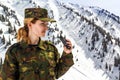 Young woman in khaki uniform with binoculars Royalty Free Stock Photo