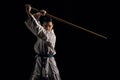 Woman in kimono practicing with jodo Royalty Free Stock Photo