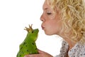 Young woman kissing a frog prince Royalty Free Stock Photo