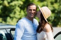 Young woman kissing man by car Royalty Free Stock Photo