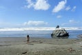 A young woman beside kissing rock, along the oregon coast highway, on gold beach Royalty Free Stock Photo