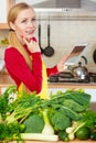 Woman having green vegetables thinking about cooking Royalty Free Stock Photo