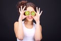 Young woman with kiwi