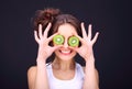 Young woman with kiwi