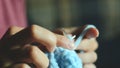 Young woman knits with circular knitting needles