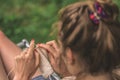 Young woman knits out of wool outdoors Royalty Free Stock Photo