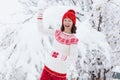 Woman in sweater playing snow ball fight in winter Royalty Free Stock Photo