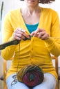 Young woman is knitting