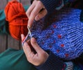 Young woman is knitting, hands of a knitter