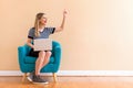 Young woman with a laptop computer pointing something Royalty Free Stock Photo