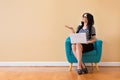 Young woman with a laptop computer pointing something Royalty Free Stock Photo