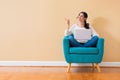 Young woman with a laptop computer pointing something Royalty Free Stock Photo