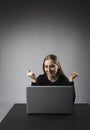 Young woman with laptop. Excited female Royalty Free Stock Photo