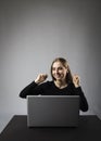 Young woman with laptop. Excited female Royalty Free Stock Photo