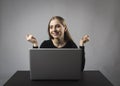 Young woman with laptop. Excited female Royalty Free Stock Photo