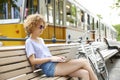 Young woman with laptop outdoor