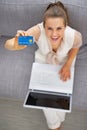 Young woman with laptop showing credit card Royalty Free Stock Photo