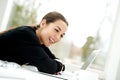 Young woman laughing as she reads her laptop Royalty Free Stock Photo