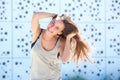 Young woman laughing with hand in hair Royalty Free Stock Photo