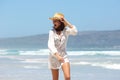 Young woman laughing with hat at the beach Royalty Free Stock Photo