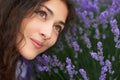 Young woman is in the lavender field, beautiful portrait, face closeup, summer landscape with red poppy flowers Royalty Free Stock Photo