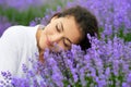 Young woman is in the lavender field, beautiful portrait, face closeup, summer landscape with red poppy flowers Royalty Free Stock Photo