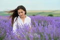 Young woman is in the lavender field, beautiful summer landscape with red poppy flowers Royalty Free Stock Photo