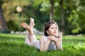 Young woman laying on grass