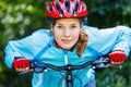 Young woman leaned over handlebar