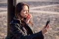 Young woman looking worried the phone Royalty Free Stock Photo