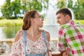 Young woman leaning on railing of the wooden gazebo with her boy Royalty Free Stock Photo