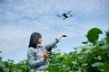 Young woman learning how to pilot her drone in, female using, piloting