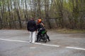 A young woman is learning to ride a motorbike in a motorcycle school. She is taught by a teacher