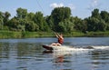 A young woman is learning to ride a wakeboard Royalty Free Stock Photo