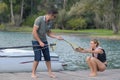 Young woman learning waterski