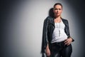 Young woman in leather clothes looks up Royalty Free Stock Photo