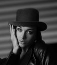 Young woman in leather jacket and hat Royalty Free Stock Photo