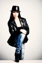 Young woman in leather jacket and hat Royalty Free Stock Photo