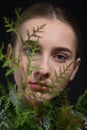 Young woman among the leaves